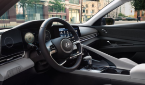 Dark Gray interior of Hyundai Elantra | Steering Wheel and Drivers Dashboard with large display screen