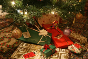 Christmas gifts wrapped underneath christmas tree